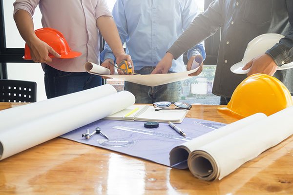 Team of architect studying plans