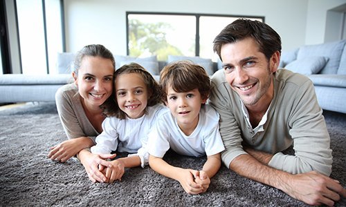 happy family lying on a soft carpet 