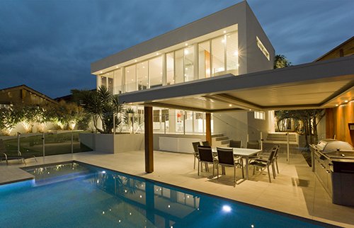 View of a newly constructed house with a pool 