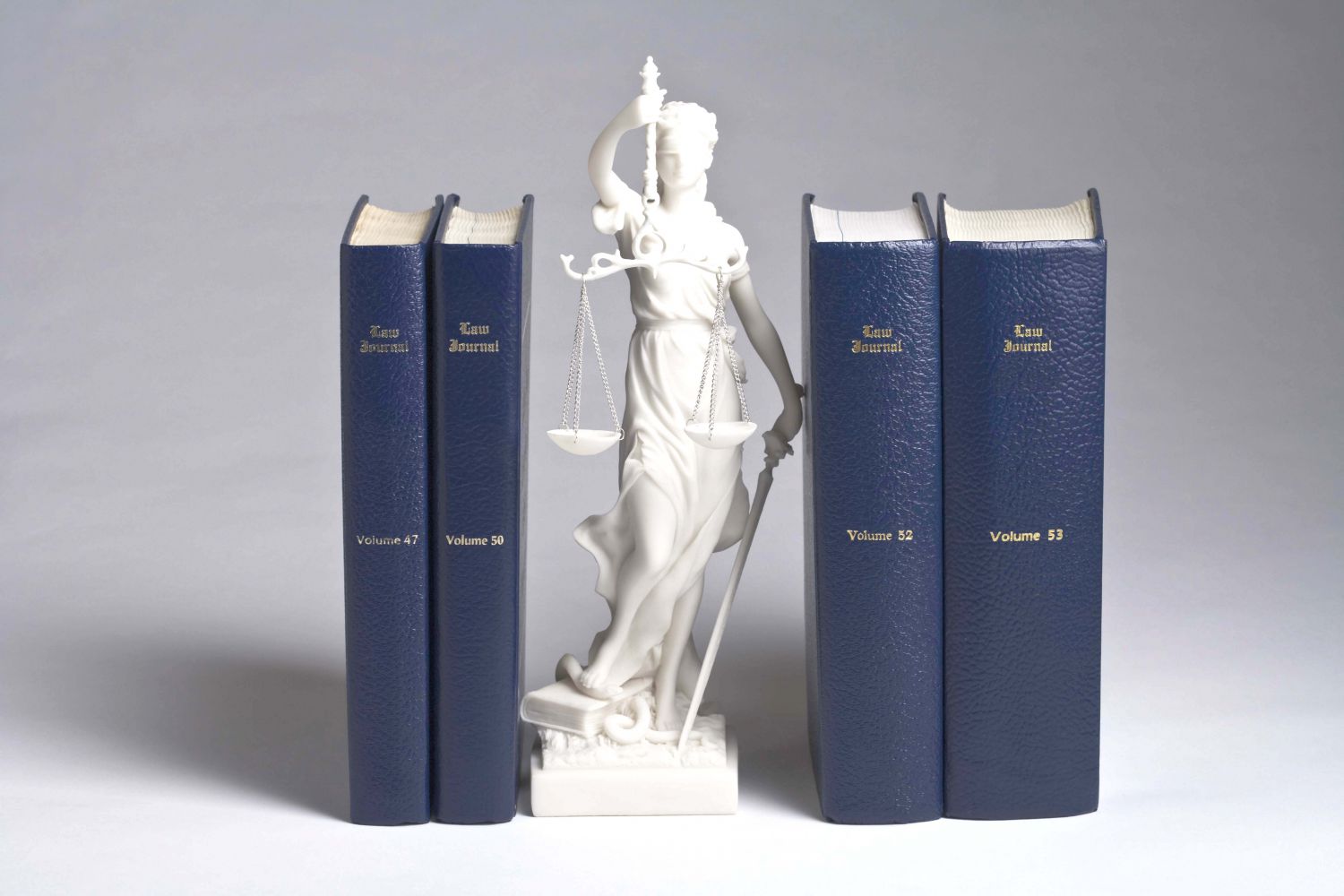 lady justice between law books