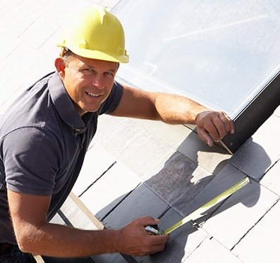 saltbush roofing man taking measurements for roofing