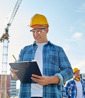 Engineer at the construction site monitoring progress