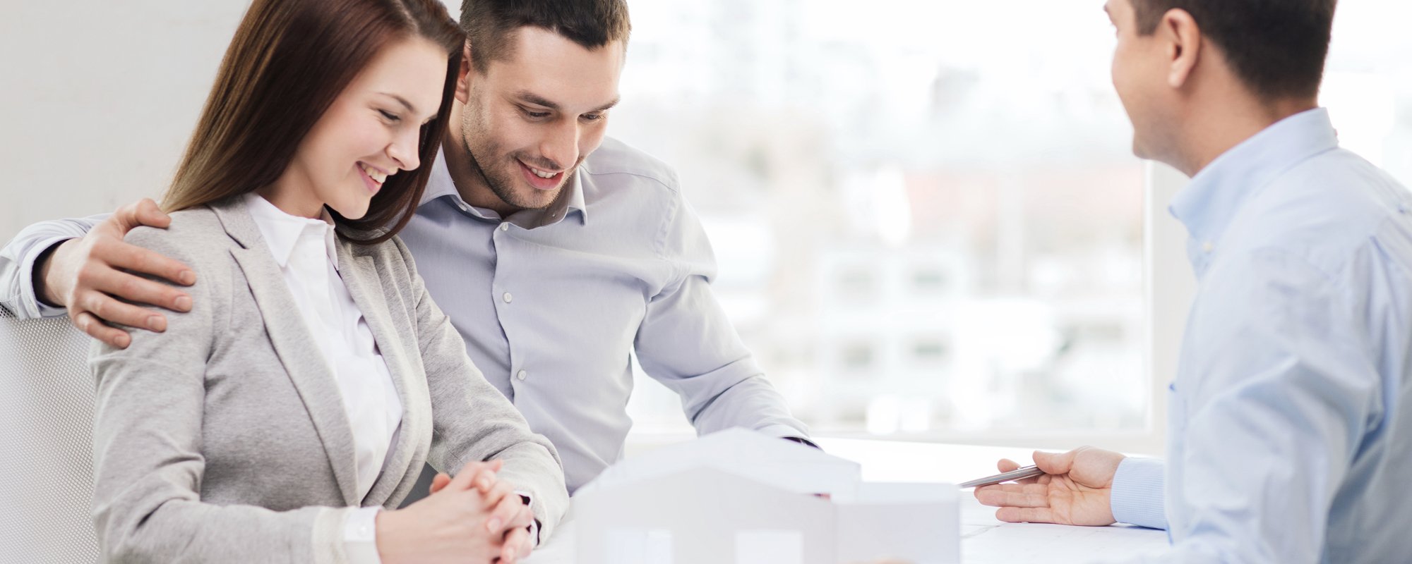 Interior designer in consultation with the young couple