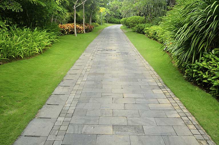 specialist landscaping and maintenance tiles path way
