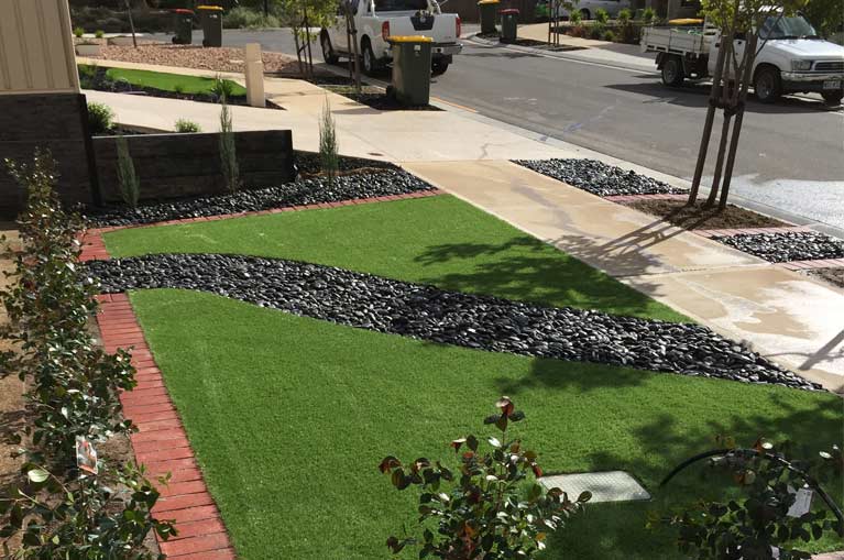 specialist landscaping and maintenance pavement across grass layout
