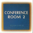 A blue sign that says conference room 2 on it.