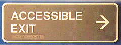 A sign that says accessible exit with an arrow pointing to the right