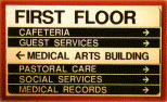 A sign that says first floor cafeteria guest services medical arts building pastoral care social services medical records