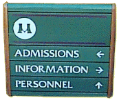 A green sign that says admissions information personnel on it.