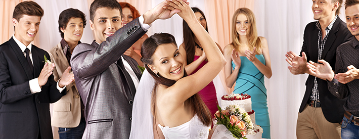 A young bride and groom at their wedding, getting ready to dance