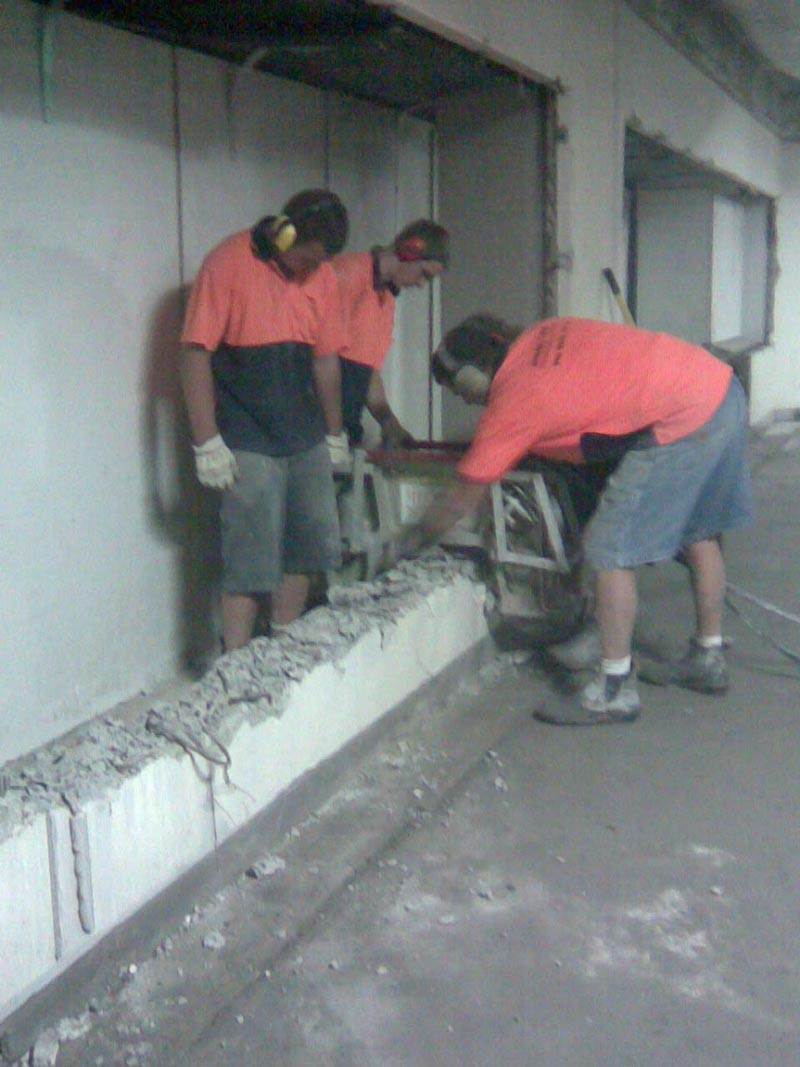 workers crushing concrete