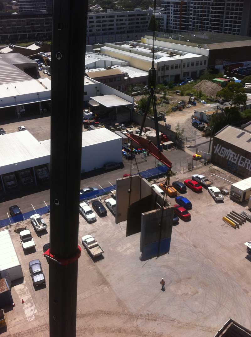 removing concrete from tower with crane