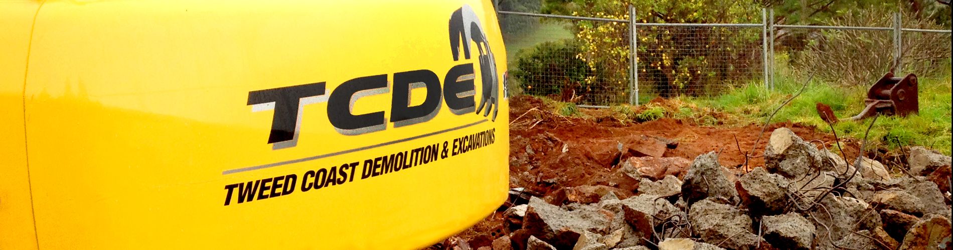 TCDE logo at the back of a demolition and excavation equipment