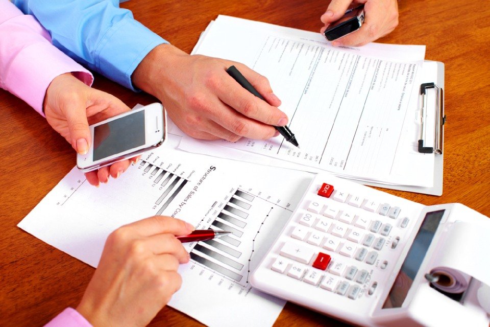 team of professionals cross verifying the report