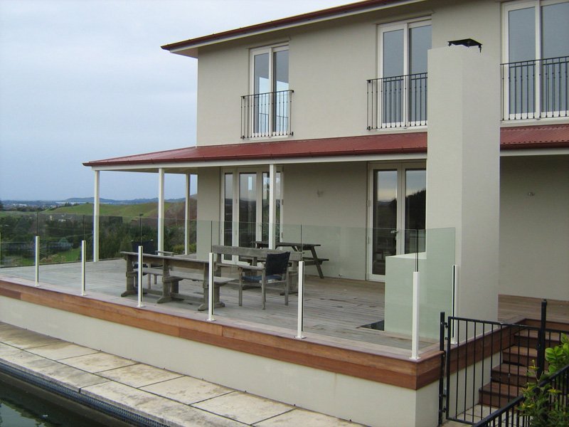 Exterior view of the house with glass fence 