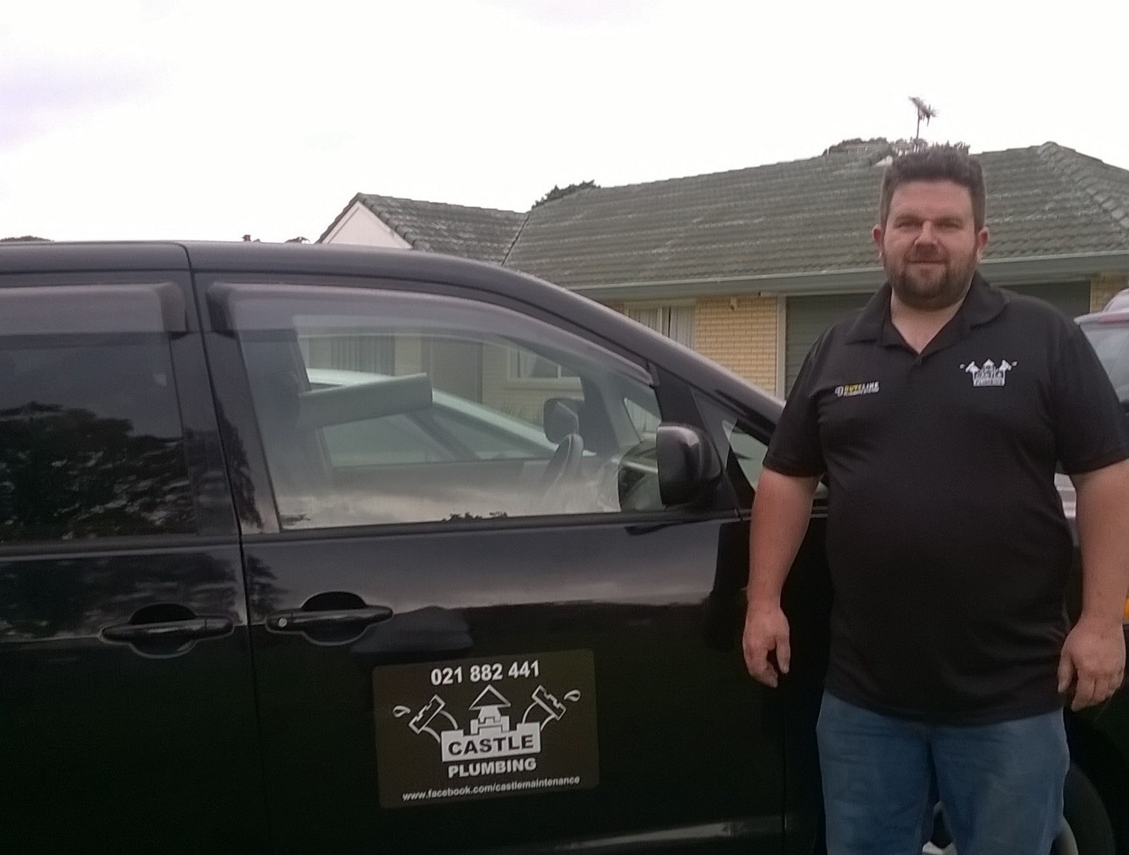 Professional providing plumbing service in home kitchen in Auckland, NZ