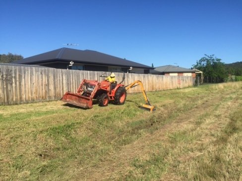 Difficult slope and drain slashing using a reach or slope mower