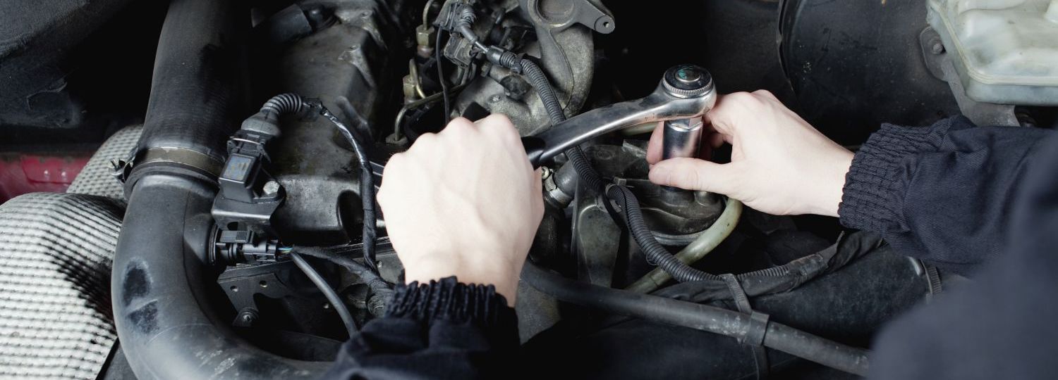 Auto electric working on a car in Oamaru