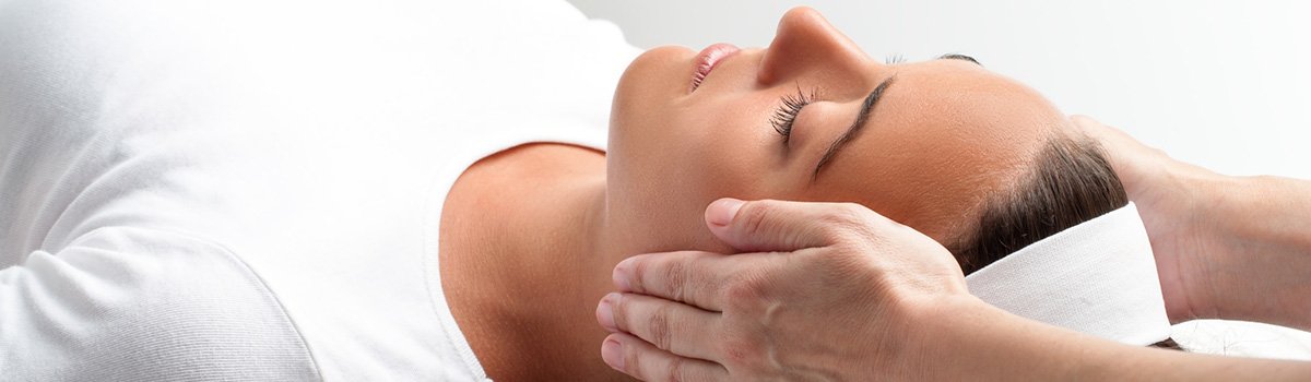 Woman receiving Spine alignment for headaches in Bunbury