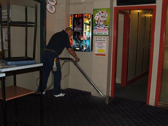 Professional removing the stains on the carpet