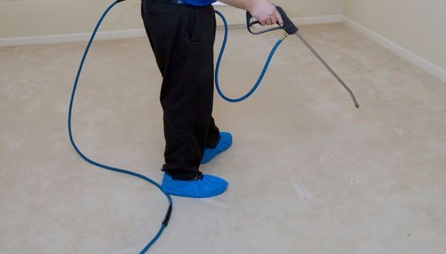 Expert cleaning the wooden  surface 