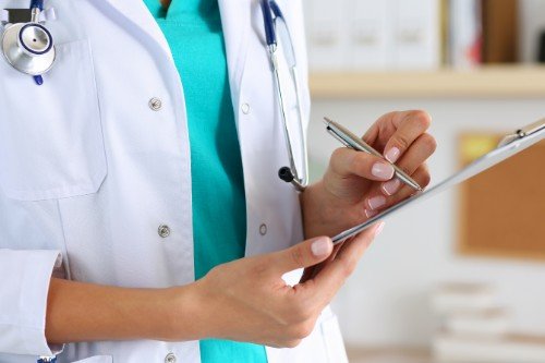 female doctor updating patient record