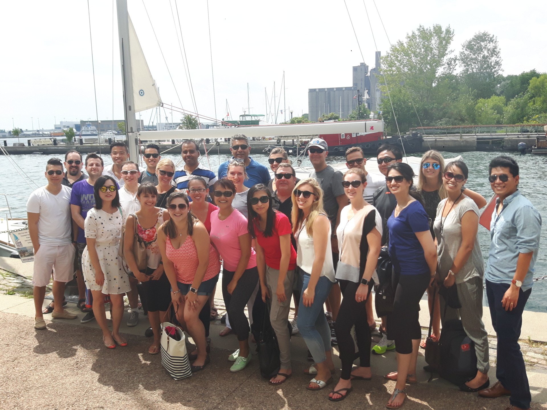 Group of people in front of a boat