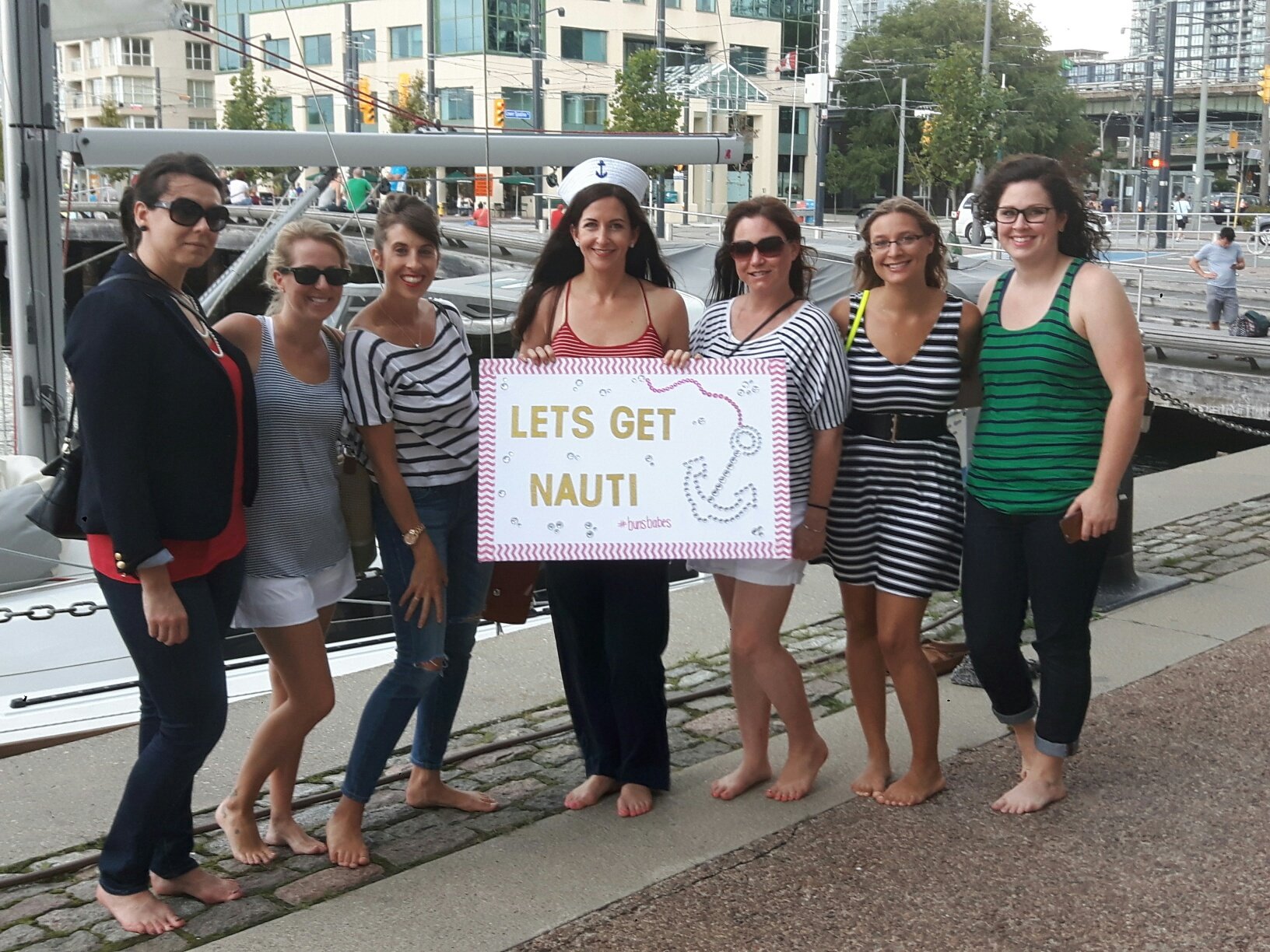 Group of girls holding a sign