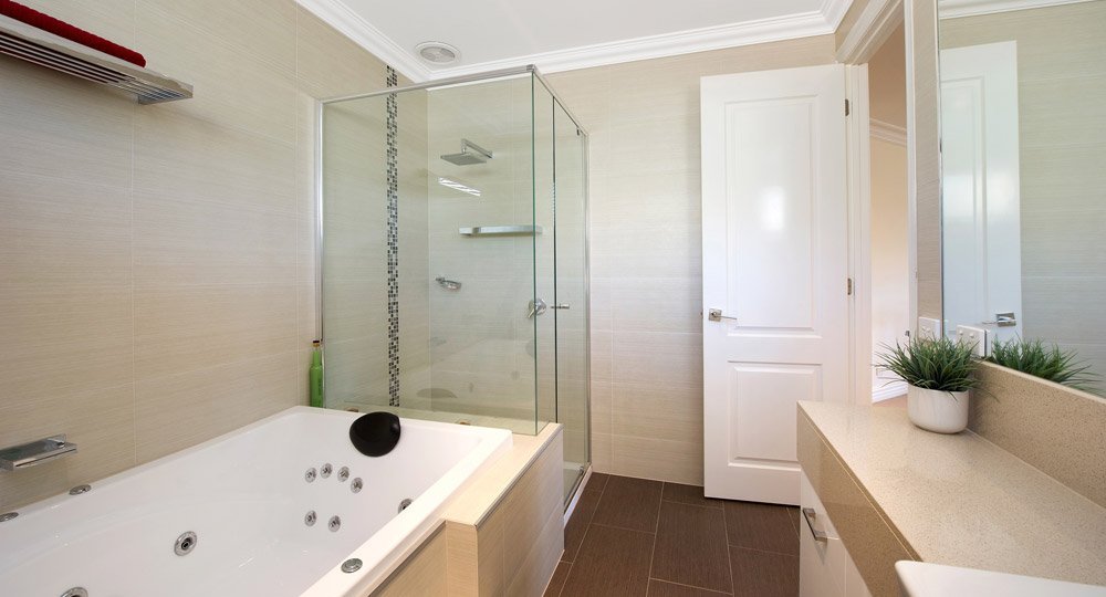 bathroom with standing shower and bathtub