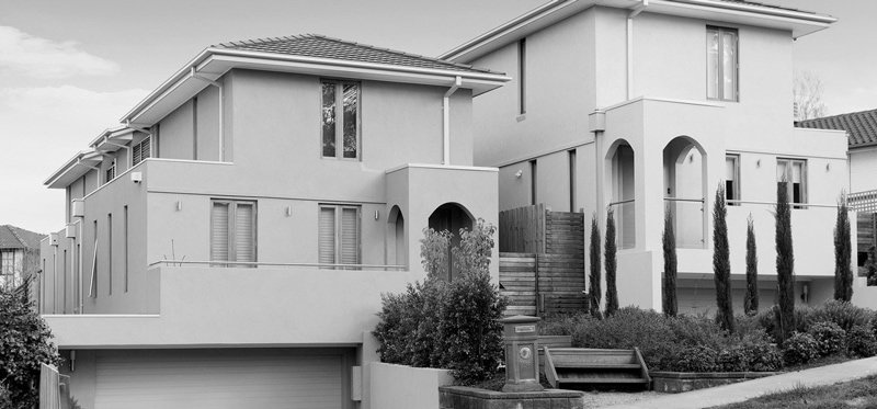 black and white photo of front view of a house