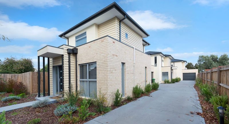 front view of white brick house