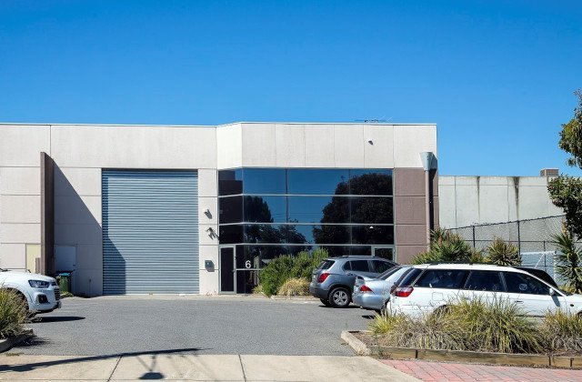 office building with big windows and parking lot