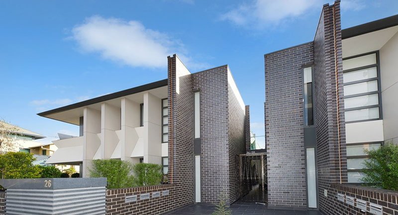 two modern buildings with alley in between