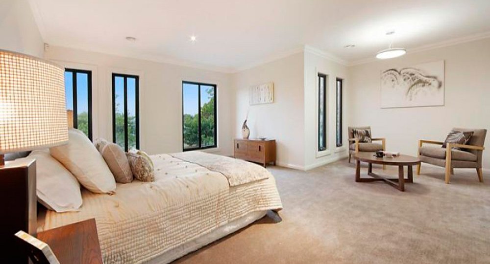 large open bedroom with window views