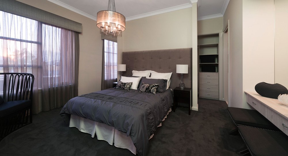 large bedroom with covered windows