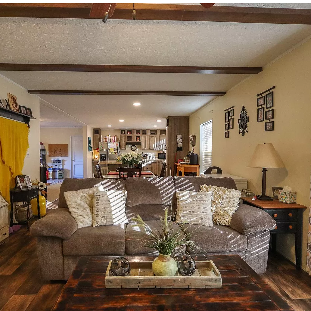 A living room with a couch and a coffee table