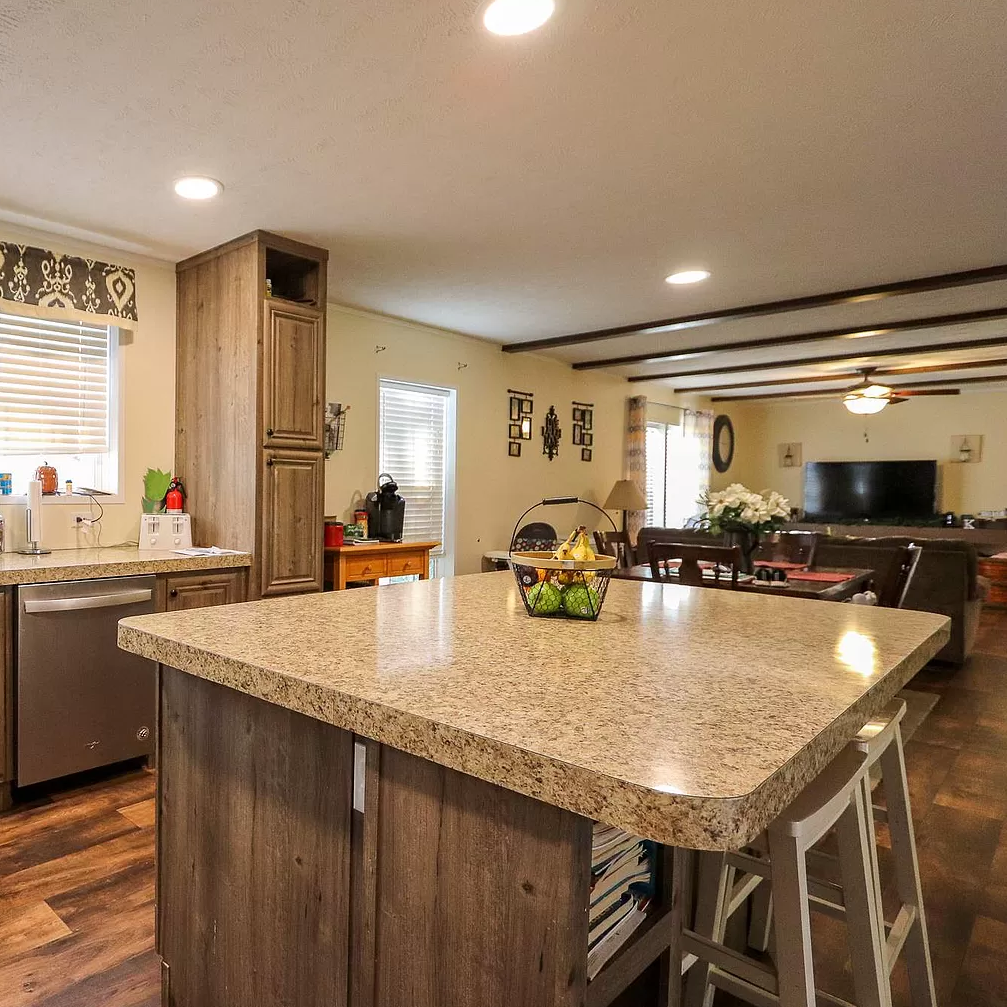 A kitchen with a large island in the middle of the room.