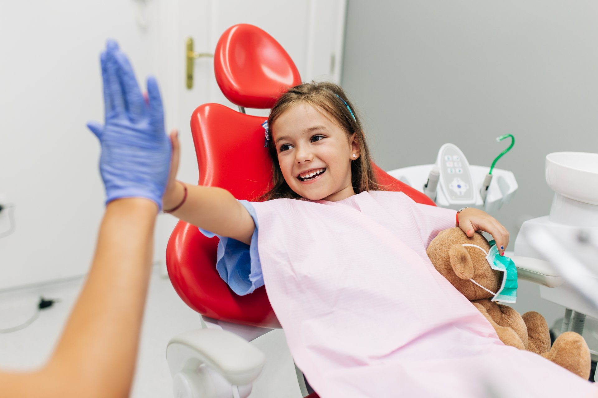 Child high-fiving dentist - Duxton Dental - Caring & Innovative Dentists Christchurch
