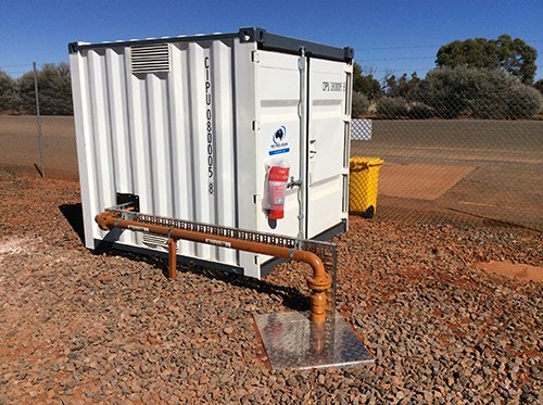 Brown color pipe going into a small container