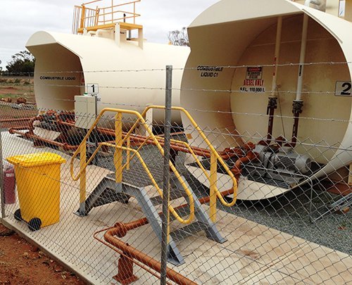 View of an oil container attached to big pipe