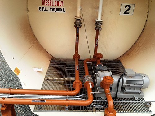 View of an oil container attached to big pipe