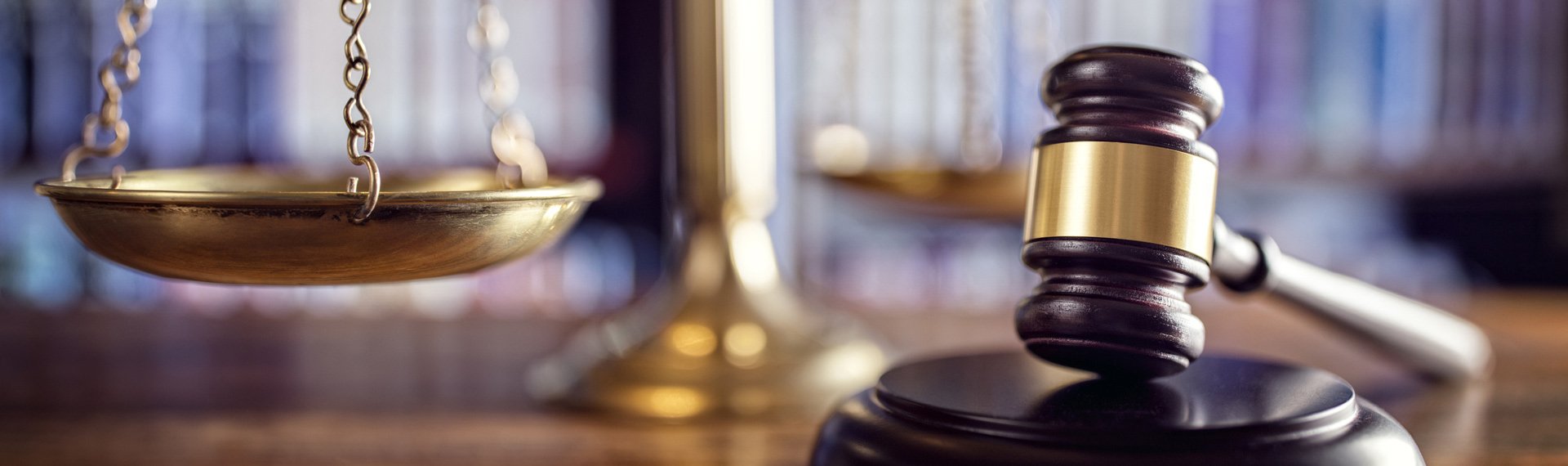 beachside legal judge gavel scales of justice and law books in court