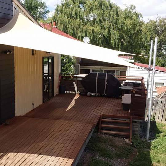 house with awning in backyard