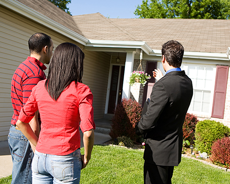 Real estate agent discussing with clients