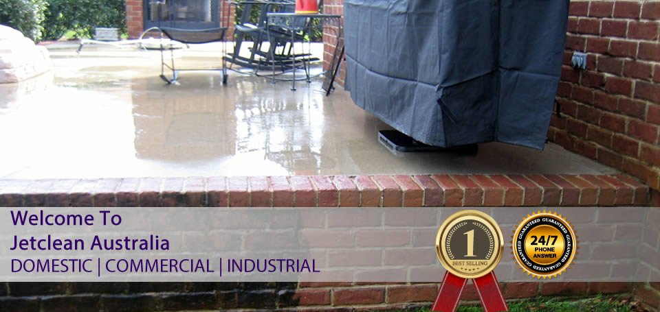 Pressure cleaning of patio floors and garden wall.