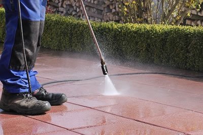 Spot pressure cleaning of stained pavers and concrete.