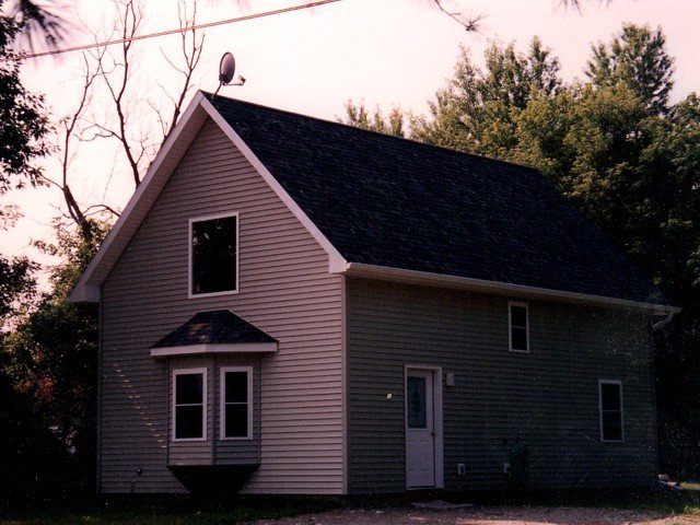 A house with a satellite dish on top of it