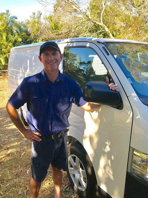 Professional standing next to the van