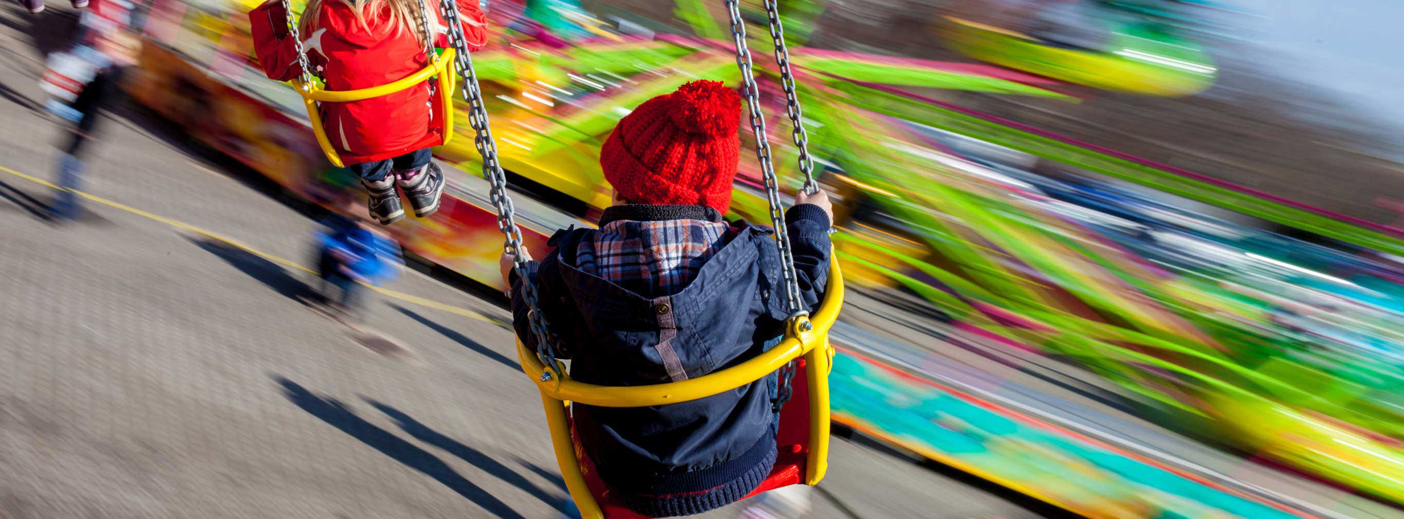 carnival amusements of s a kids having fun on a swing chain carousel ride