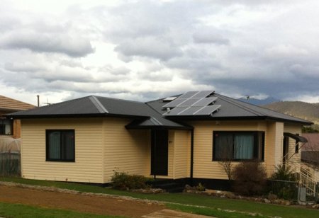 a home with solar panels on the roof